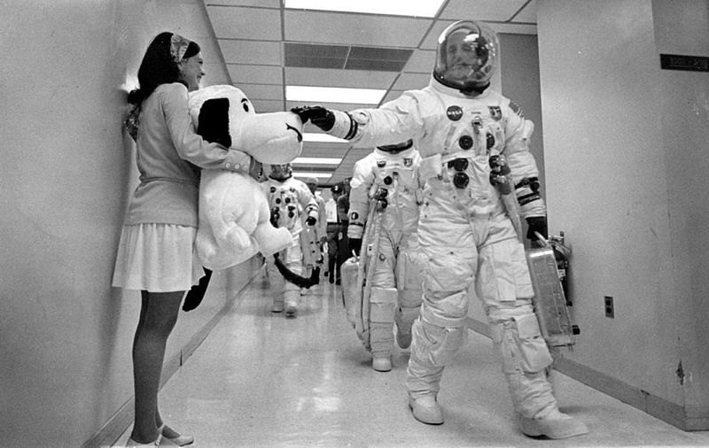 Prior to launch, NASA astronaut Thomas Stafford touches Snoopy’s nose for good luck.